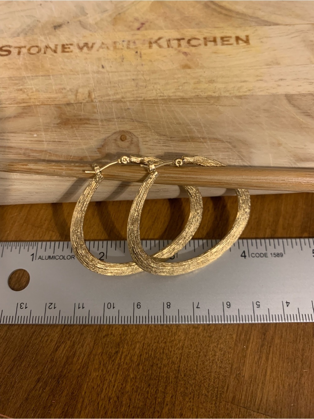 Gold tone organic shaped hoop earrings